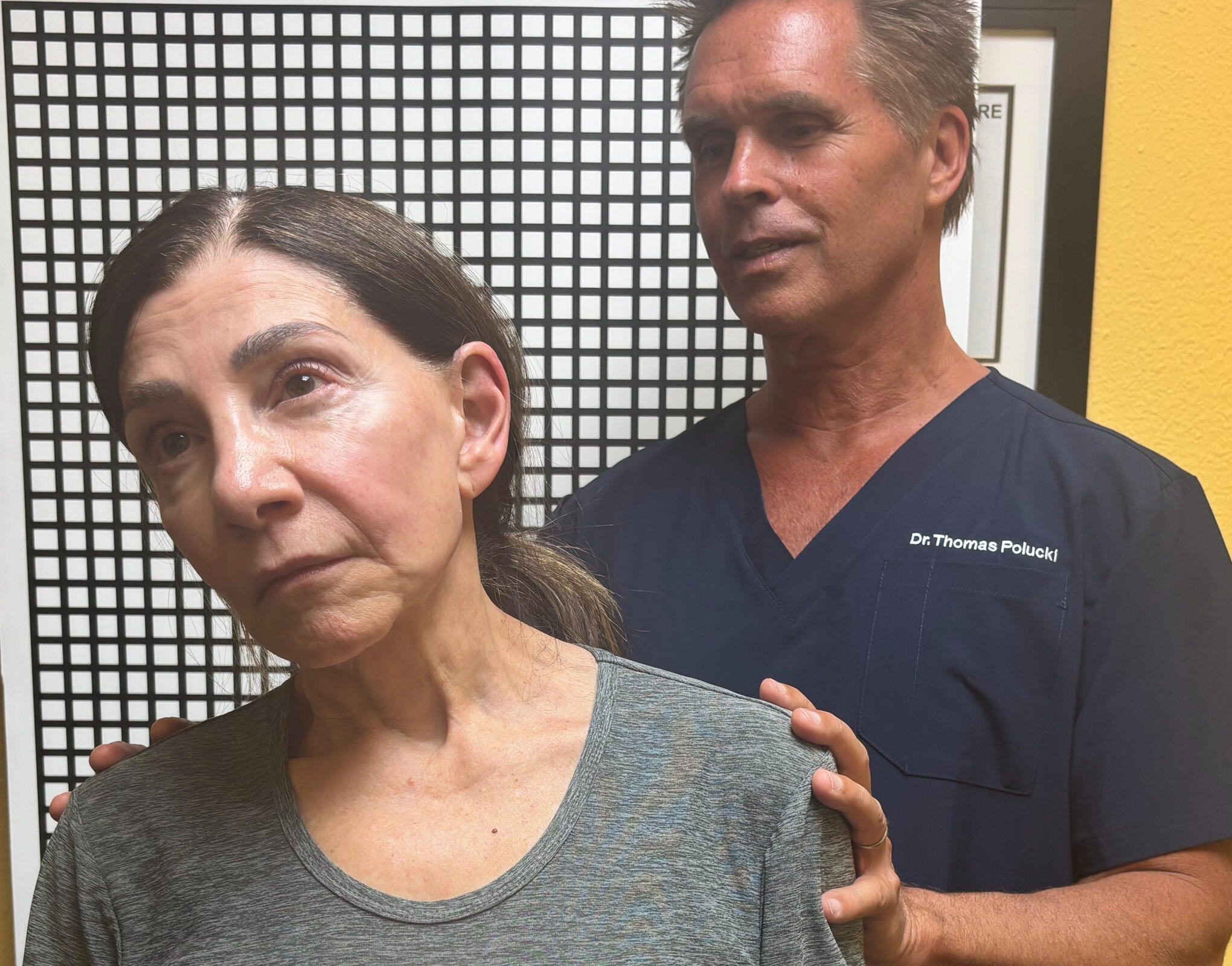 Santa Clarita chiropractor reviewing spine scan with patient Santa Clarita chiropractor Dr. Thomas Polucki observing neck motion during an exam