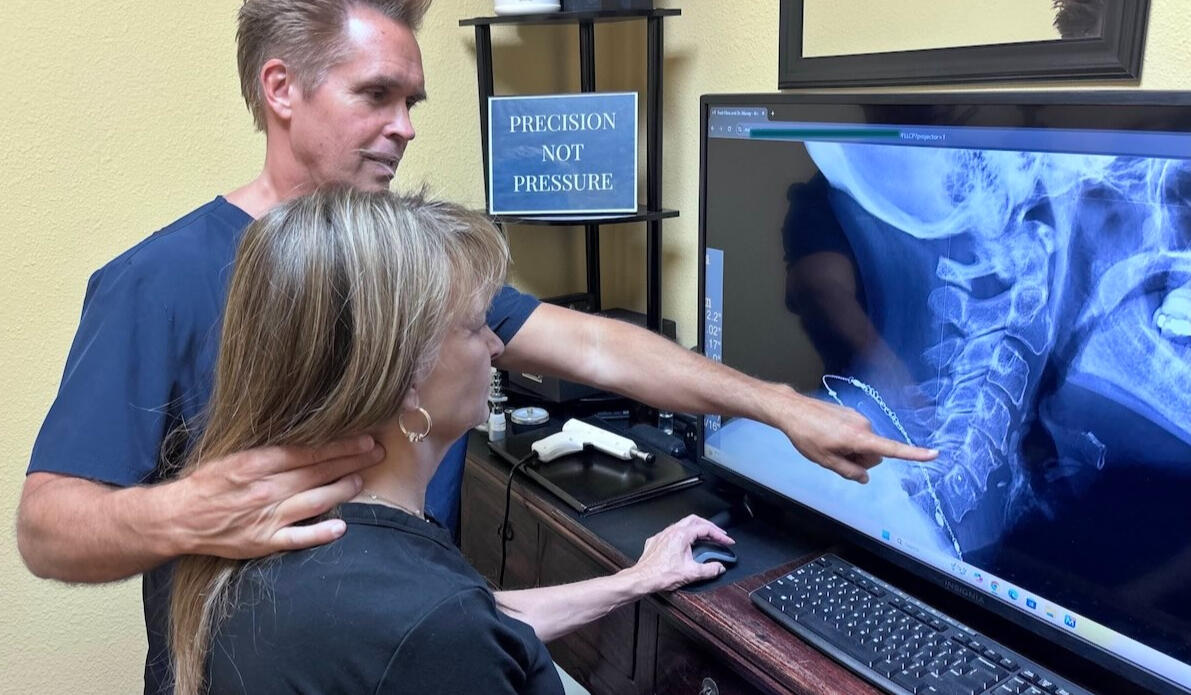 Computer posture assessment near Stevensons Ranch Dr. Thomas Polucki reviewing posture and alignment patterns during a computer-based assessment at a Santa Clarita chiropractic office.